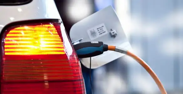 Electric car plugged into EV charger after professional installation in San Diego, CA