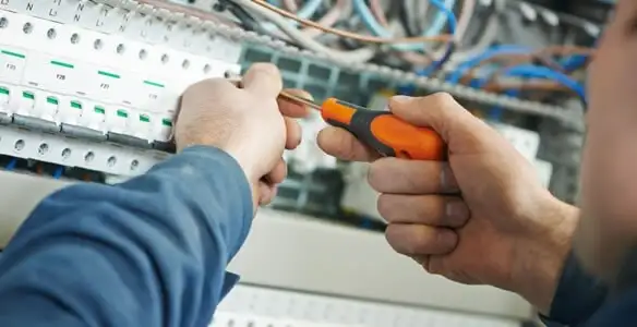 electrical service showing licensed electrician performing electrical panel maintenance and adjustments in San Diego, CA