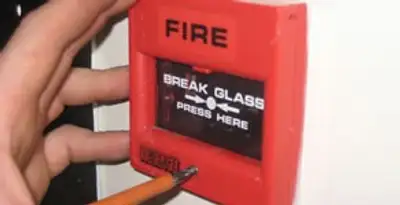 fire alarm installation service showing manual fire alarm pull station installed by licensed electricians in San Diego, CA