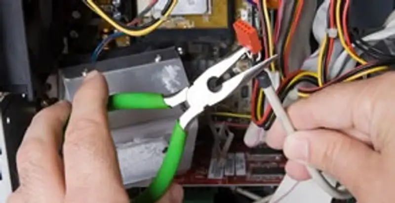 Licensed electrical contractor performing electrical repair with tools in Lemon Grove, CA
