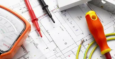 licensed electrician planning and testing electrical systems using professional tools in San Diego, CA