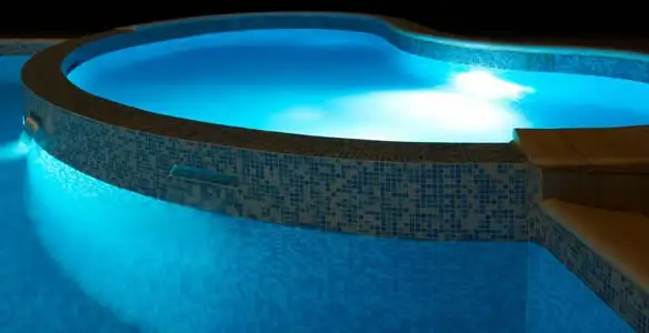pool light installation and repair services highlighting illuminated pool interior lighting in San Diego, CA