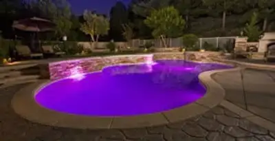 pool light installation and repair services illuminating a residential swimming pool in San Diego, CA