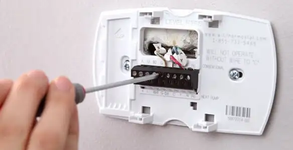 Thermostat installation service with proper wiring and secure wall mounting in San Diego, CA