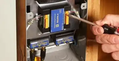 Whole home surge protection device being installed by a licensed electrician to protect electrical systems in San Diego, CA